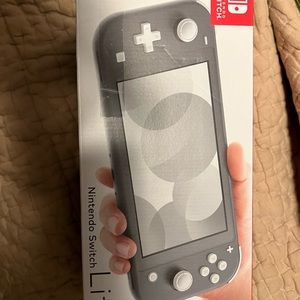 NWT never opened or used. Grey Nintendo Switch Lite